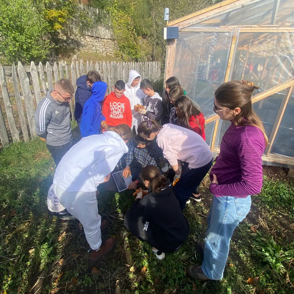 Peshkopi kids checking the monitoring systems graphs